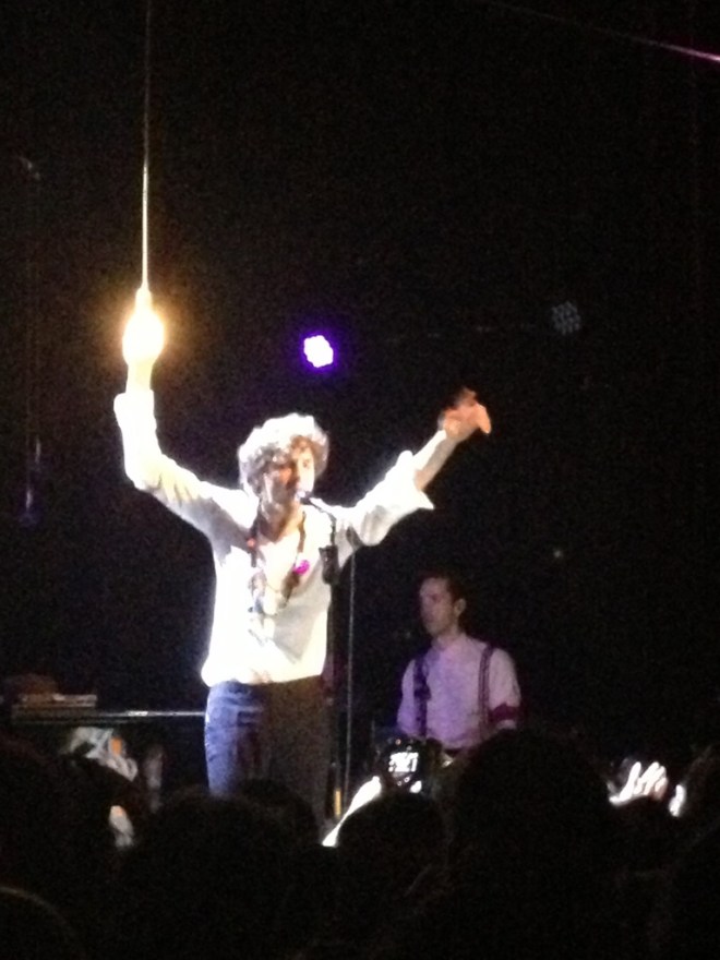 Mika holds the lightbulb tragically